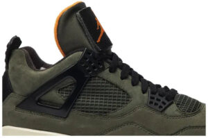 Olive green basketball sneaker with black lattice panels, black laces, and an orange Jumpman logo on the tongue.