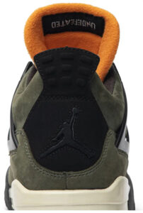 Rear view of an olive suede Jordan sneaker with an orange padded collar and Jumpman logo on the heel panel (beige sole).