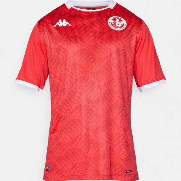 Red football jersey with a pixel-like pattern, white collar trim, a white Kappa logo on the chest, and the Tunisian Football Federation crest on the left.