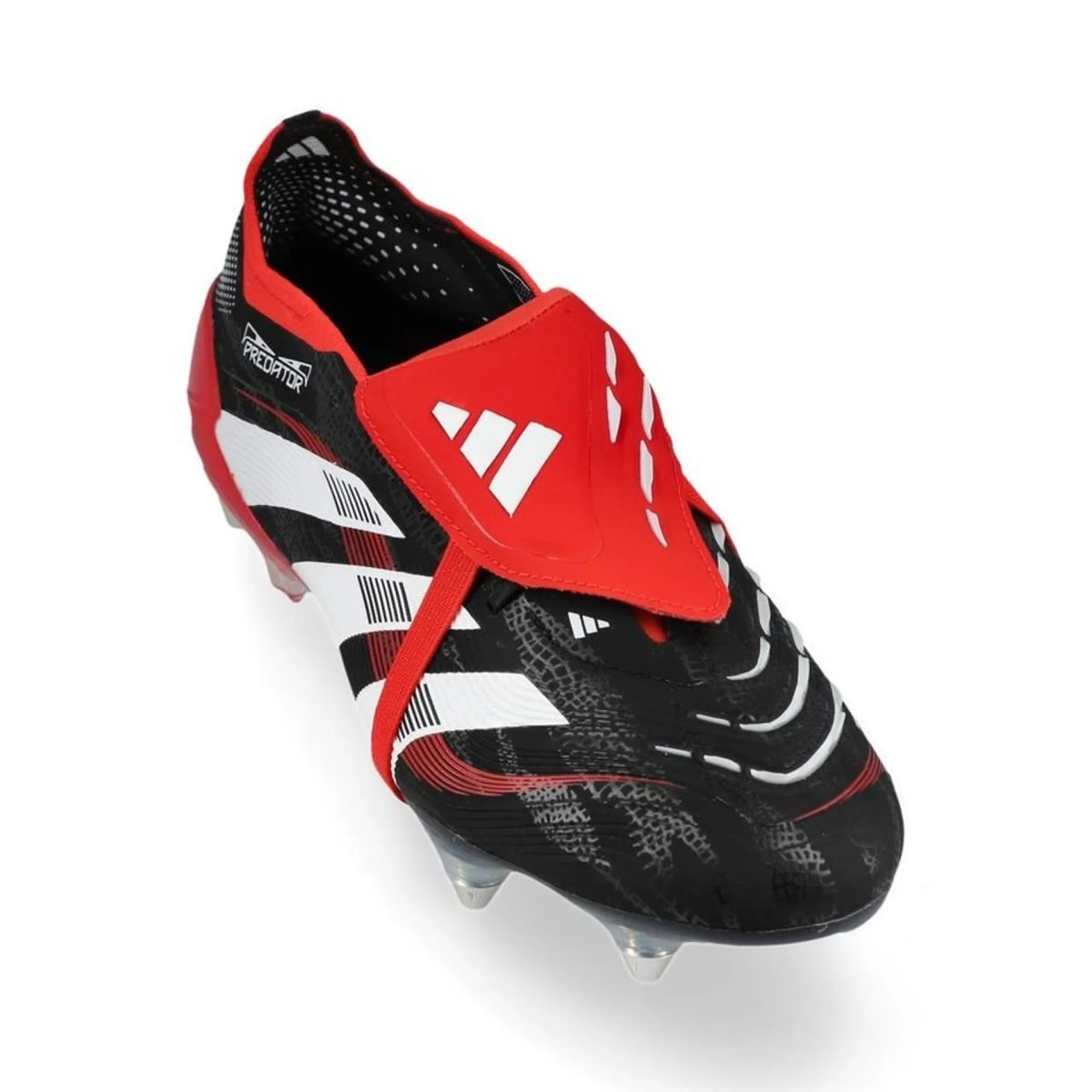 Close-up of a red and black Adidas Predator soccer cleat with white accents and studded sole.