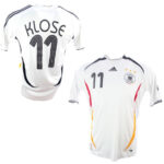 Two white Germany national team soccer jerseys shown from back and front; back displays 'KLOSE' and number 11, front shows crest, Adidas logo, and three stars with red/yellow accent seams.