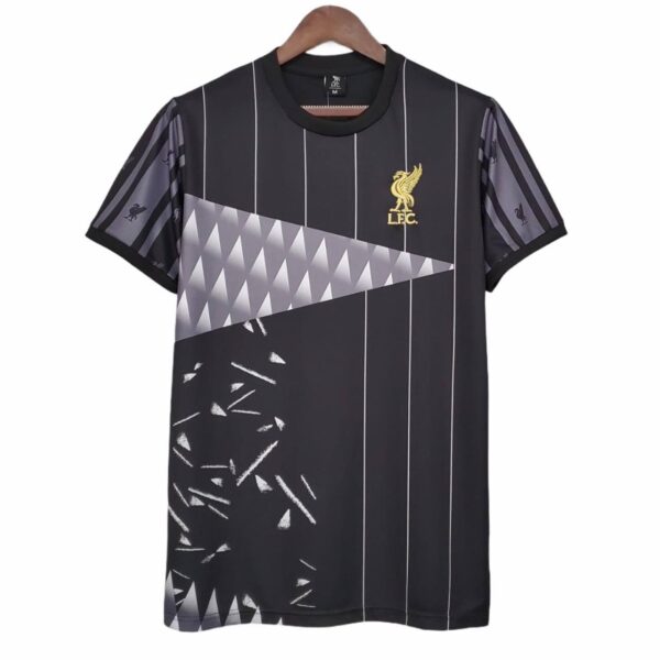 Black football jersey with white pinstripes and geometric grey panel across chest, Liverpool FC crest in gold on left chest