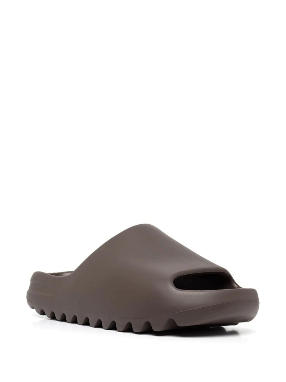 Brown slip-on platform sandal with a thick, ridged sole and cutout strap, shown from the side.
