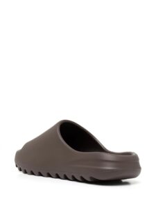 Brown platform slide sandal with a thick sole, open toe, shown in side view.