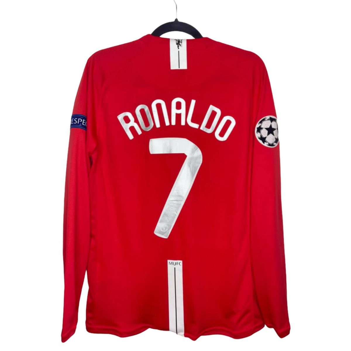 Red Manchester United jersey with Ronaldo 7 name and number on the back, carrying a Champions League patch on the right sleeve.