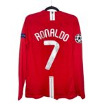 Red Manchester United jersey with Ronaldo 7 name and number on the back, carrying a Champions League patch on the right sleeve.