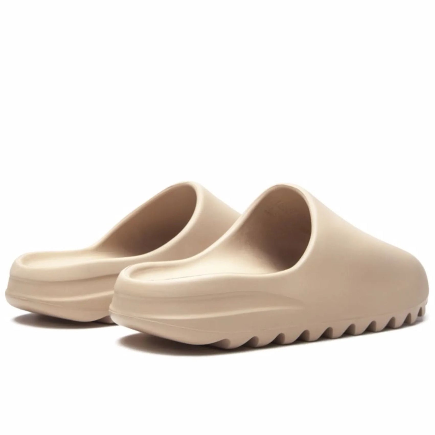 17738013_37285939_2048 Beige platform slide sandals with thick ridged soles, shown from a low front angle.