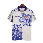 Real Madrid football jersey on a hanger with Teka sponsor and club crest.