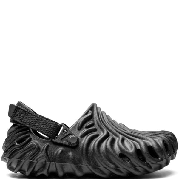 Black textured water shoe with an adjustable strap and buckle, shown from the side.