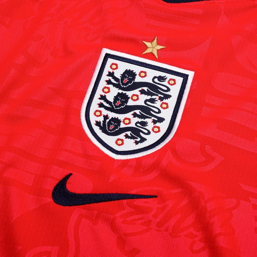 1926d252d276 | UAE SPORT STORE England national team crest (three lions) on a red jersey with a gold star above and a Nike swoosh nearby