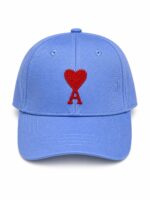 Blue baseball cap with red heart and letter "A" embroidery.