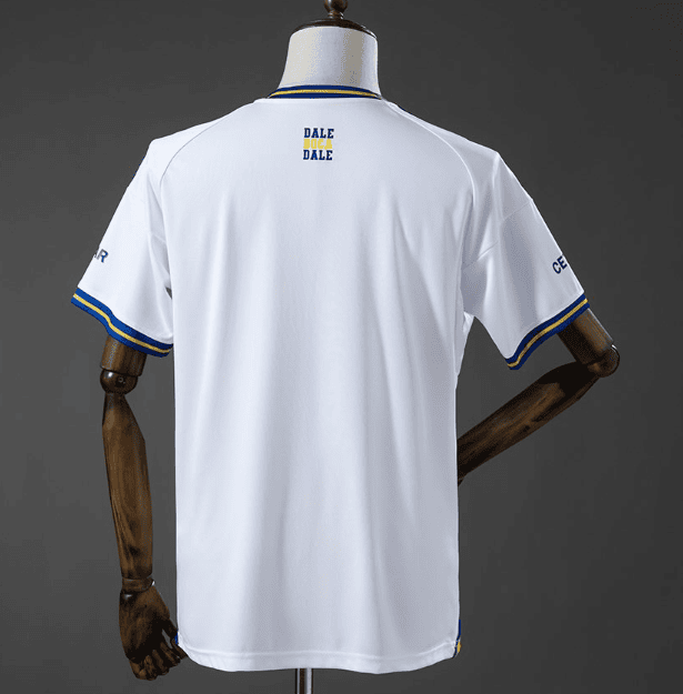 1_d5c05d3a-b6f6-410c-8686-2583018df0d3 | UAE SPORT STORE Back view of a white sports jersey with blue and yellow trim, mannequin displaying small 'DALE DALE' logo on upper back and blue/yellow sleeve cuffs.