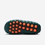 Recovery slides with teal color and orange massage dots for foot relief.