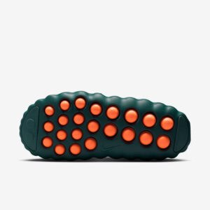 Recovery slides with teal color and orange massage dots for foot relief.