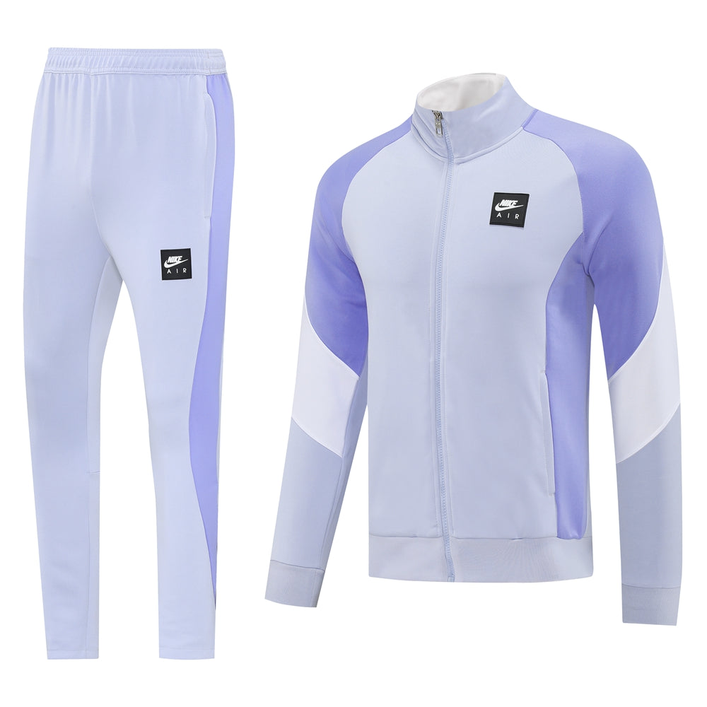1bb94f64 | UAE SPORT STORE Lilac Nike Air tracksuit jacket and pants set with color-block panels on the sleeves and legs.