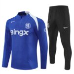 Blue Chelsea FC training jersey with BingX sponsor and white Nike logo, paired with black Nike pants with white swoosh.