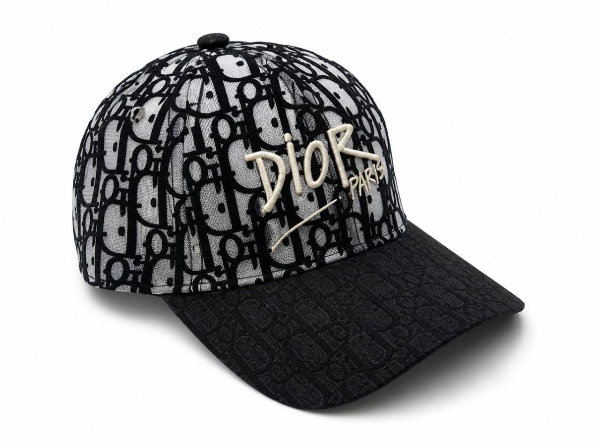 Baseball cap with black-and-gray Dior monogram pattern and beige “Dior Paris” embroidery.