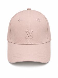 Pink baseball cap in soft pink with matching pink LV initials on the front; small decorative logos on either side for brand embellishment.