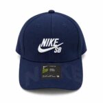 1c712df9-3b0e-4632-8119-78ffe22fdb34 | UAE SPORT STORE Front view of a navy blue Nike SB baseball cap with white embroidered Nike swoosh and branding on the front panel.