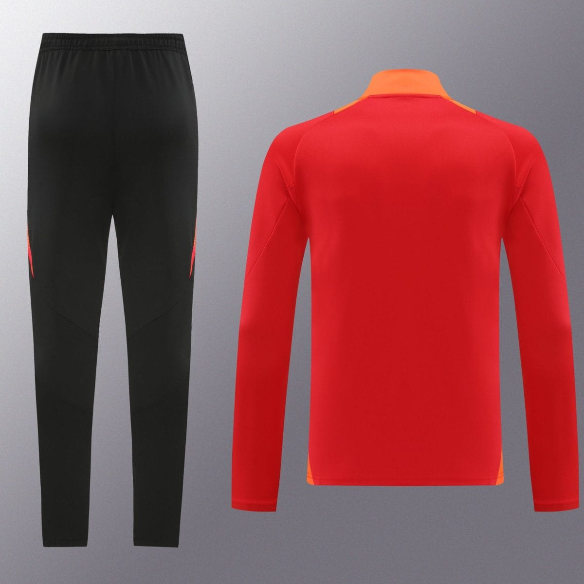 Black athletic pants on the left paired with a bright red long-sleeve sports top featuring an orange collar on the right, shown against a gray backdrop.