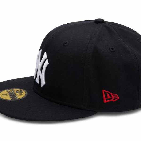 Black baseball cap with a white raised NY logo on the front, red New Era logo on the side, and a gold sticker on the brim.