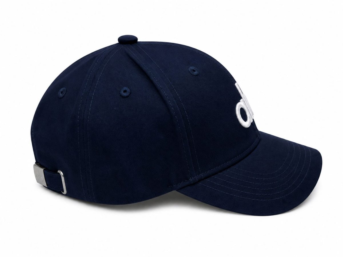 Navy baseball cap with a curved brim and an adjustable metal strap at the back, side view shown.