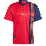 Red and blue Adidas Spain national team jersey with crest and vertical stripe pattern on the right side, short sleeves.