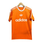 Orange Adidas soccer jersey on a hanger with white logos and stripes, front view