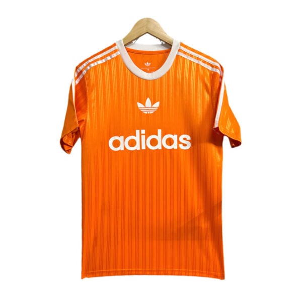 Orange Adidas soccer jersey on a hanger with white logos and stripes, front view