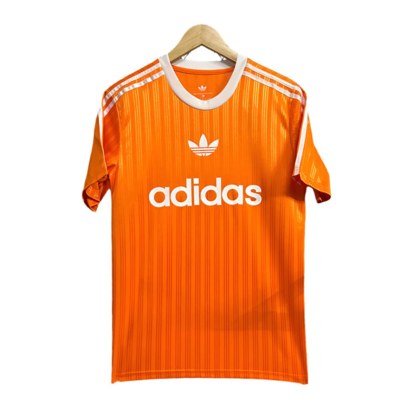 1ee4171f Orange Adidas soccer jersey on a hanger with white logos and stripes, front view