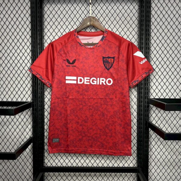 Red Atlético Madrid football jersey on hanger with DEGIRO sponsor and team crest, displayed against a mesh background.