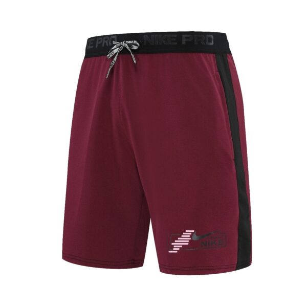 Maroon Nike Pro athletic shorts with a black waistband and a black side stripe, tied with a drawstring, Nike logo on the front left leg.