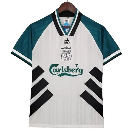 White Liverpool FC jersey on a hanger: white body, teal sleeves, black diagonal panels and Carlsberg sponsor.