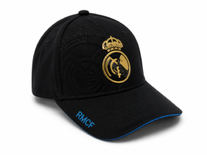 Black cap featuring a gold Real Madrid crest on the front and blue-trimmed brim with 'RMCF' embroidered in blue on the edge.