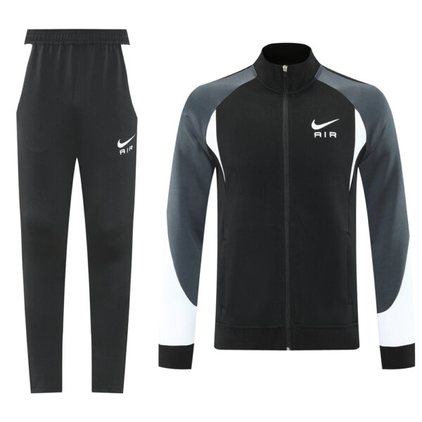 Black and gray Nike tracksuit: zip-up jacket with white swoosh and AIR logo, matching black jogger pants with Nike emblem on thigh.