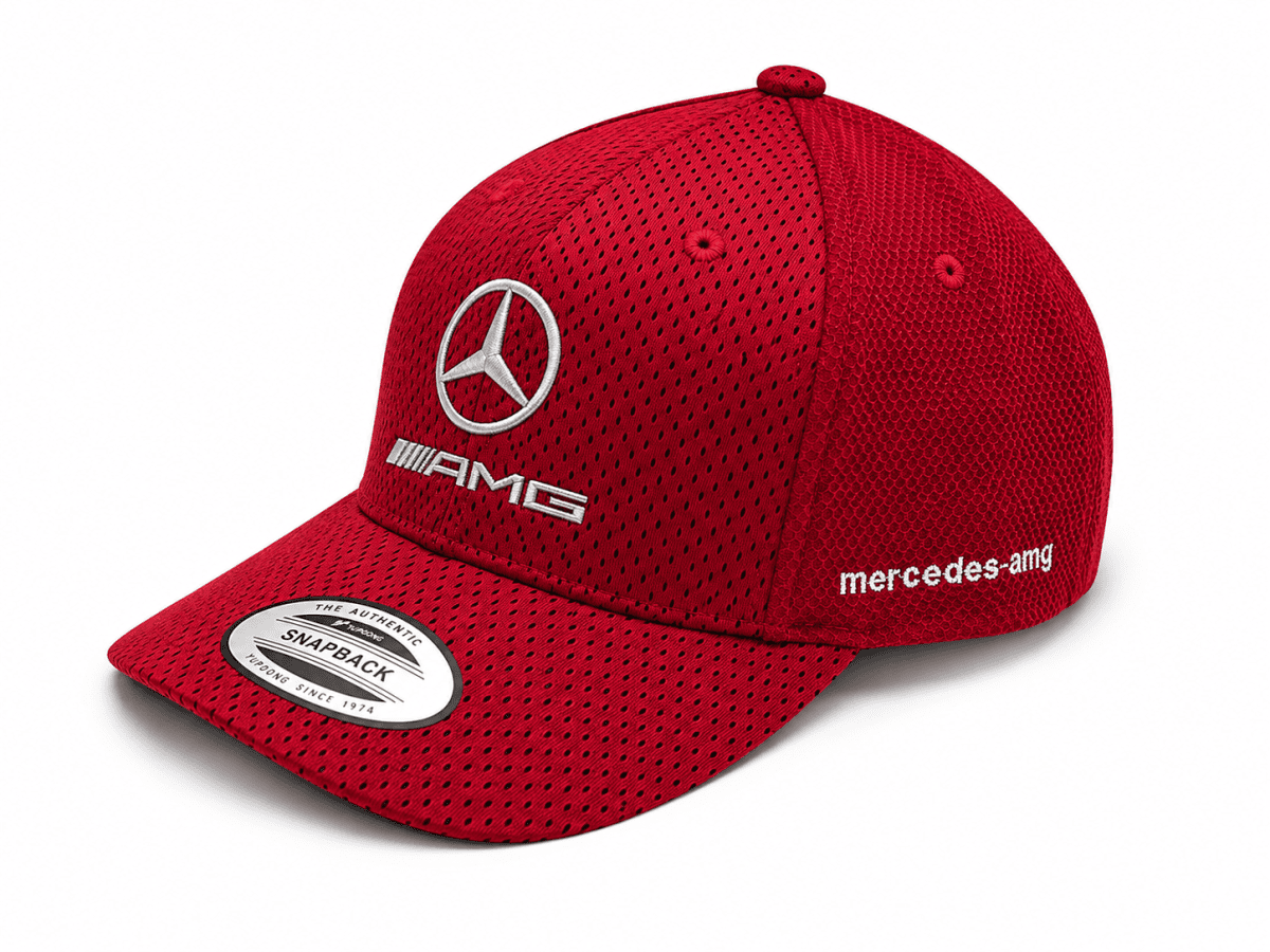 Red Mercedes-AMG cap with mesh fabric, featuring the Mercedes logo and 'mercedes-amg' branding on the side front.