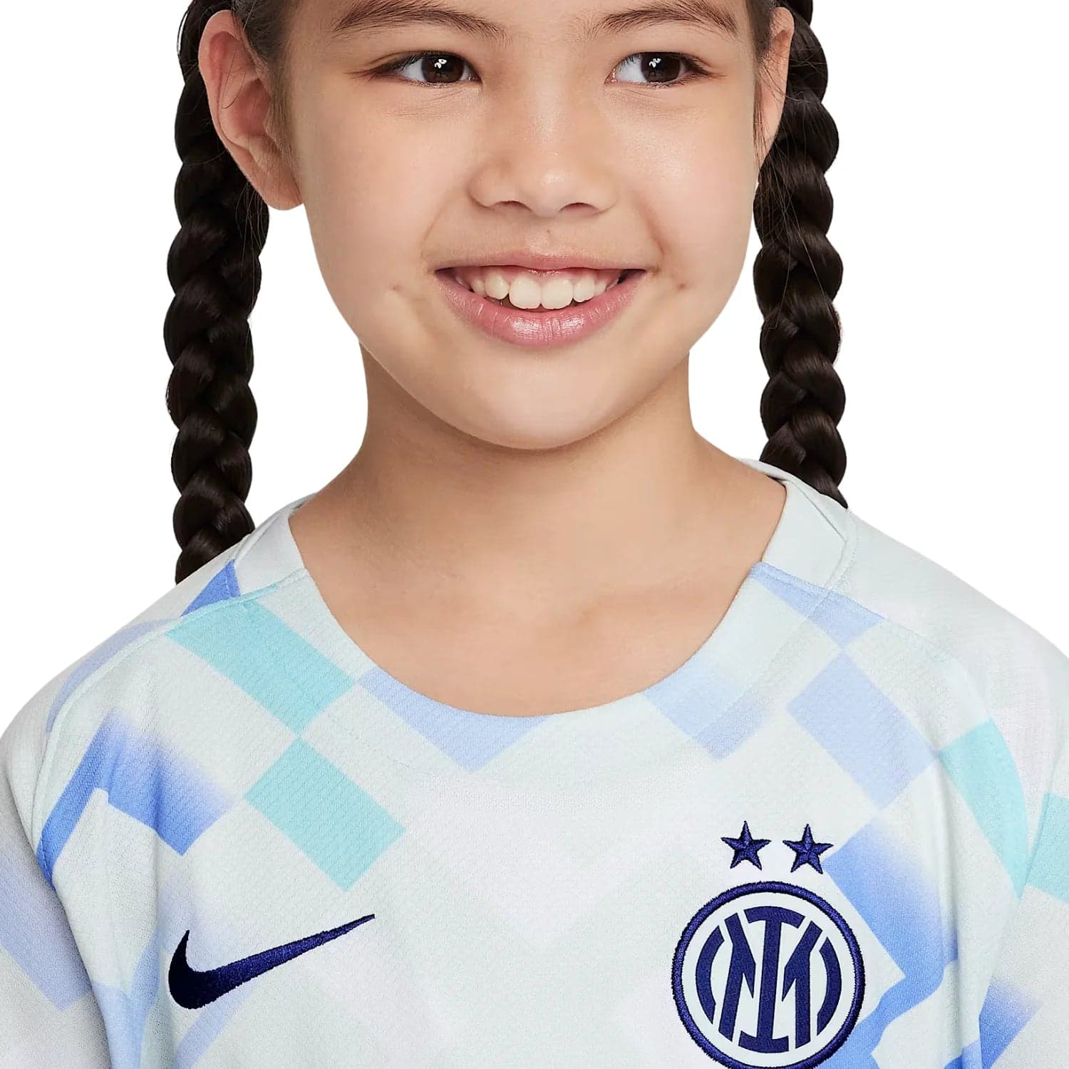 21_e639d09c-1f19-4f4e-b2fa-d2c20b43fc12 | UAE SPORT STORE Smiling girl with braided hair wearing an Inter Milan football jersey featuring the club crest and stars, cropped at shoulders.