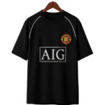 Black T-shirt on a hanger with Manchester United crest and AIG sponsor logo on the front.