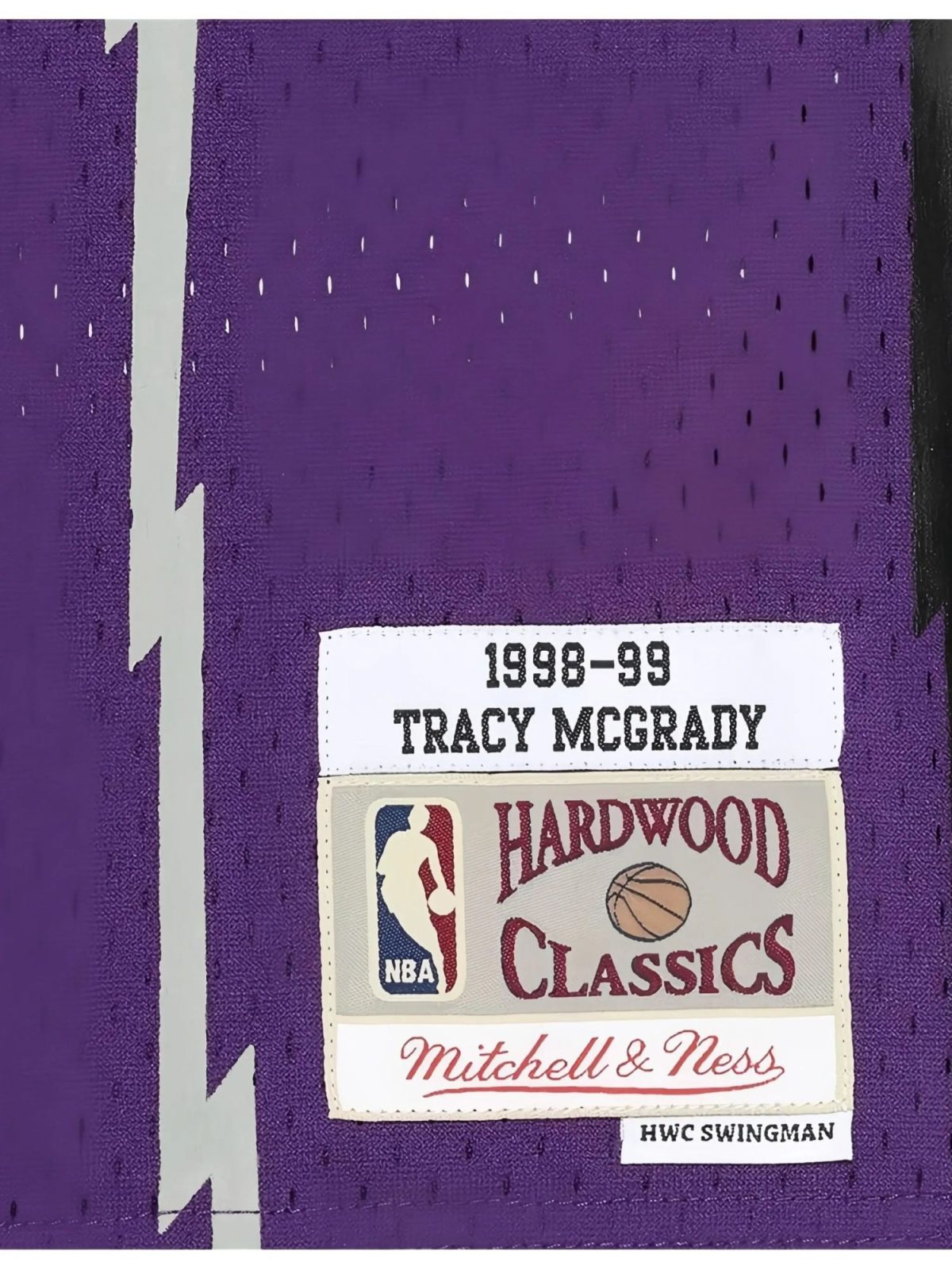 Purple background with a white label reading '1998-99 Tracy McGrady' and an NBA Hardwood Classics sticker nearby.