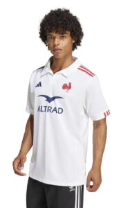 22947d20f31c100645ef21468e4a717c | UAE SPORT STORE Male model wearing a white rugby jersey with red rooster crest, blue ALTRAD logo, and red stripe details on shoulders.