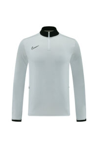 Light gray Nike long-sleeve pullover with a black stand-up collar and half-zip, featuring the Nike swoosh on the chest