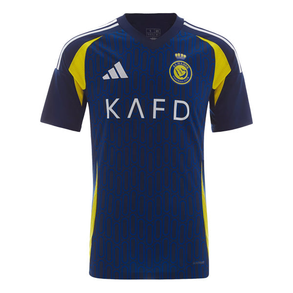Blue soccer jersey with a geometric pattern, yellow side panels, Adidas logo, sponsor 'KAFD', and club crest on the chest.