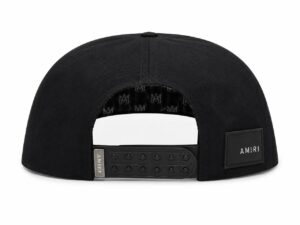 Rear view of a black baseball cap with an adjustable plastic strap and an AMIRI patch on the side.