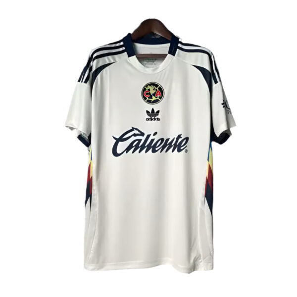 White Adidas football jersey with Club América crest and Caliente sponsor on the chest, hanging on a wooden hanger.