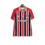 Red, black, and white striped soccer jersey on a hanger, featuring the SPFC crest and the 'SUPERBET' sponsor logo.