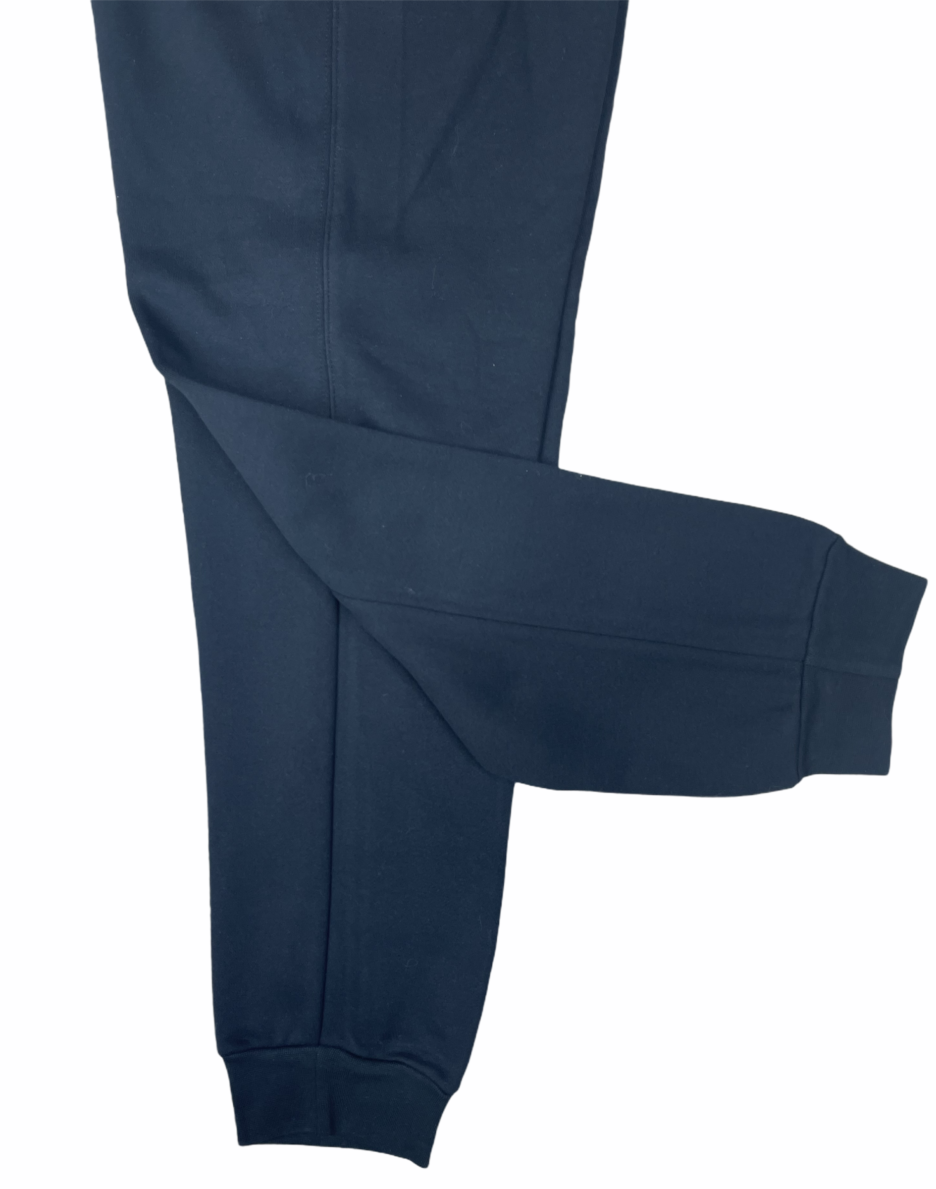 258EF5CF-C4CE-4DA0-BCA7-14A957DF7584_1b57f44f-aa0b-4ee8-a07e-0fcac1252adc | UAE SPORT STORE Close-up of a navy blue pant leg with a visible seam and cuff at the bottom, laid flat.