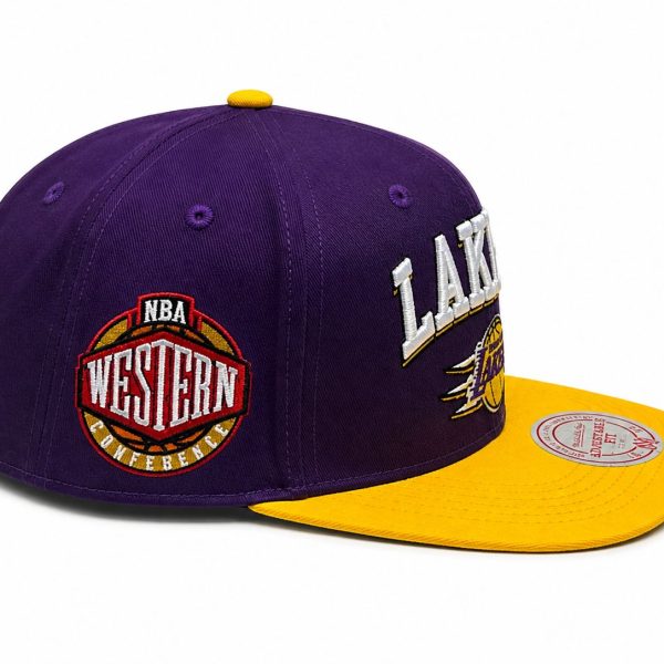 Purple Los Angeles Lakers cap with a bright yellow brim and yellow top button, featuring Western Conference patch on the side.