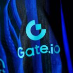 Close-up of a blue striped fabric featuring the turquoise Gate.io logo and text.