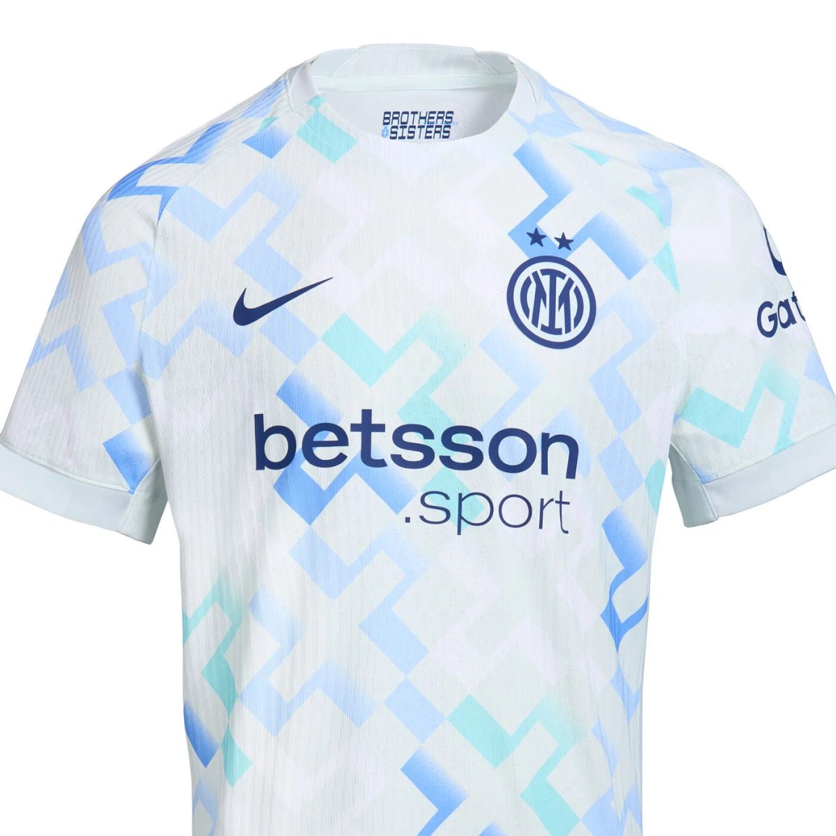 Inter Milan away jersey with light blue geometric pattern, crest, sponsor 'betsson', and Nike swoosh (close-up).