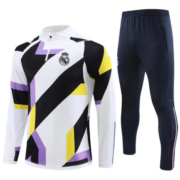 Geometric-pattern Real Madrid training jersey in white with black, purple, and yellow accents, paired with navy track pants.